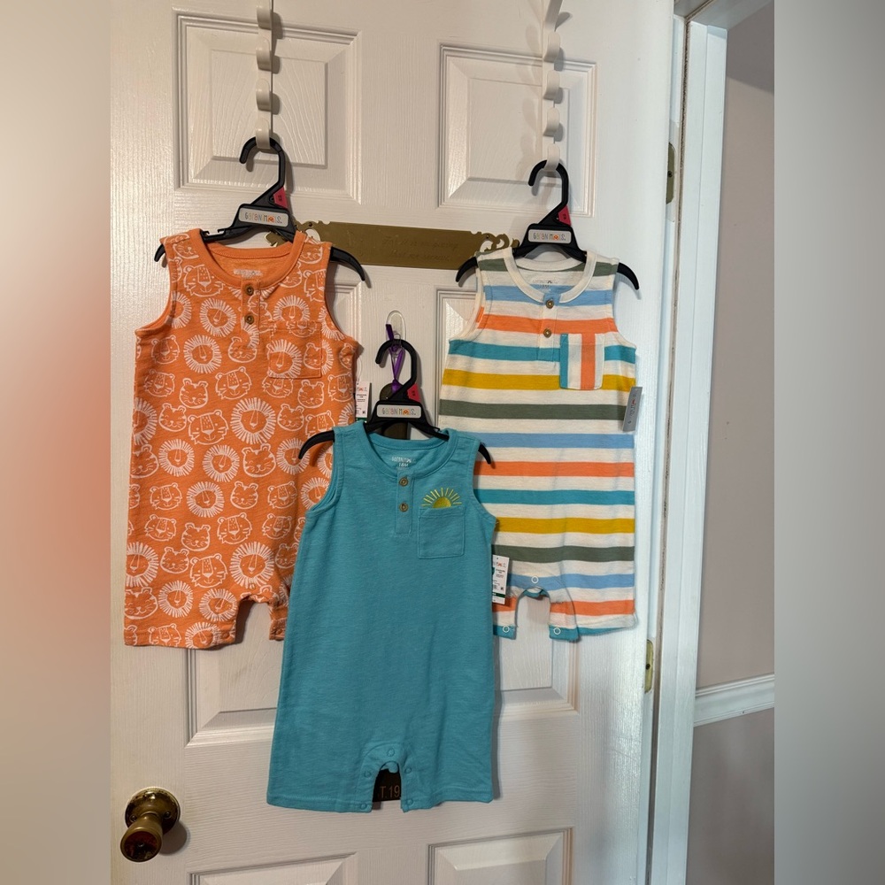 Garanimals baby boy colorful sleeveless rompers; size: 18M. You get 3 of them.